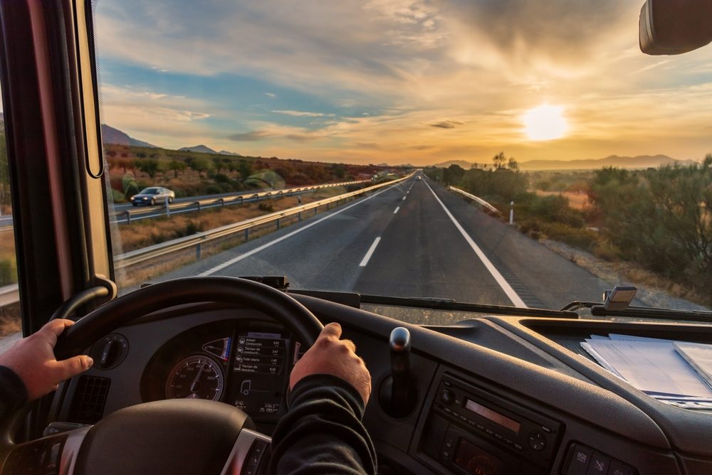 A truck driver sits behind the wheel on a Georgia highway. Some drivers do get fired after a crash, depending on fault and company policy.