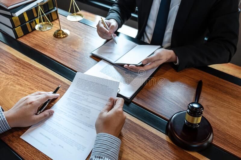 Lawyer meets with client to explain what SIPDE stands for and discuss filing a car accident claim.