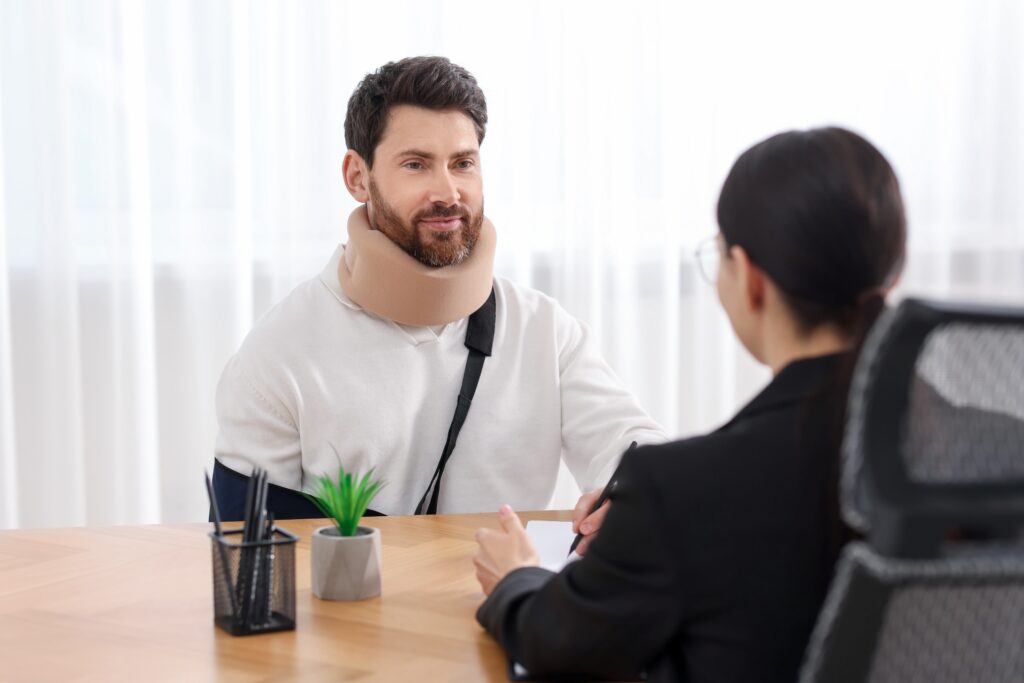 An injured man meets with an attorney to find out what a slip and fall lawyer does.